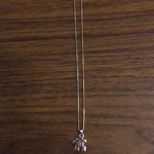 Sterling silver “S” puzzle piece necklace